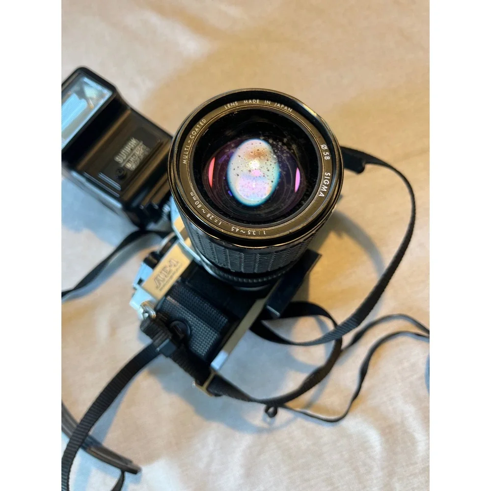 Canon AE-1 Program 35mm SLR Film‎ Camera Bundle with 50mm Lens Flash and Bag